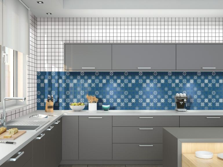 Modern kitchen design with blue tile backsplash, grey cabinets, white countertop, and stylish decor elements.